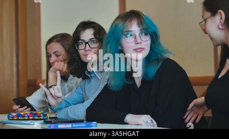 Students fully engaged in school activities, working together, and interacting with learning materials throughout a successful school day Stock Photo