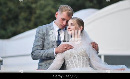 Newlyweds sharing intimate embrace, wedding moment capturing deep emotional connection Stock Photo