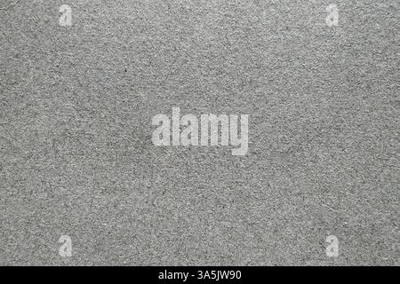 Gray cardboard texture, close-up. Neutral, rough surface with visible grain  natural imperfections. Ideal for backdrops, packaging or design project Stock Photo