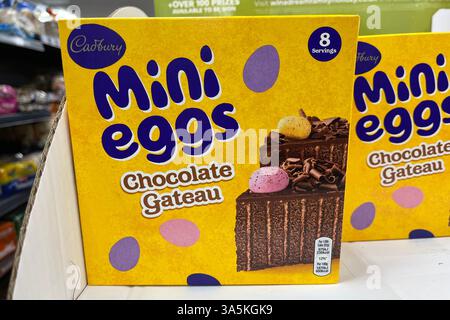 Cadbury Mini Eggs Chocolate Gateau Cake Box on a Supermarket Shelf. 23rd March 2025. Stock Photo