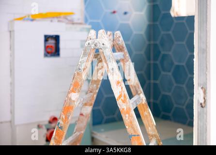 Stepladder in empty bathroom during improvement works Stock Photo