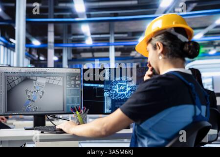 Photovoltaic facility system administrator developing AI tool in factory to predict equipment failures. Solar panels plant programmer coding artificial intelligence algorithms to minimize downtime Stock Photo