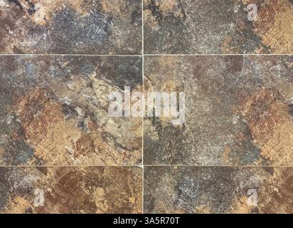 Close up of rusty and weathered granite stone texture, suitable for outdoor and exterior flooring. Oxidized, copper and grey color. Seamless stone bac Stock Photo