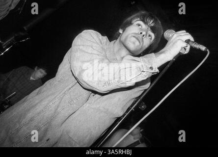 OASIS, FIRST NATIONAL TOUR, 1994: Liam Gallagher, Noel Gallagher and original drummer Tony McCarroll of Oasis at The Fleece and Firkin in Bristol, England, March 30 1994. At this early gig the legendary band played as a support to another up-and-coming indie group called Whiteout. Photograph: Rob Watkins.  INFO: In 1994, Oasis burst onto the British music scene with their debut album Definitely Maybe, redefining Britpop with raw energy and anthemic songs. Led by brothers Liam and Noel Gallagher, their attitude, swagger, and hits like Live Forever made them instant rock icons. Stock Photo