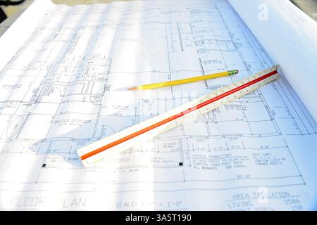 Architectural blueprint with a pencil and scale ruler on a work Stock Photo