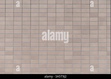 Beige ceramic clay tile brick wall background Stock Photo