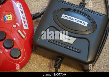 Retro mini games console Sega Mega Drive. 16 Bit video game tech - London UK 4 September 2022 Stock Photo