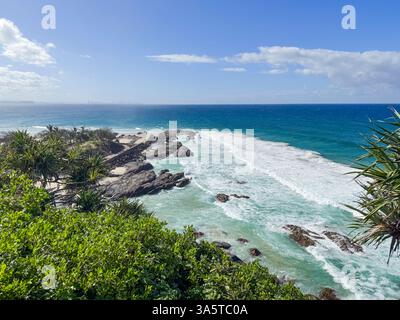 Beach with rocks and waves crashing on the rocks. Gold Coast, Queensland, Australia Stock Photo