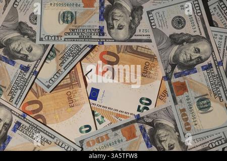 A visually captivating array of diverse currency notes featuring a mixed background of USD and Euro Stock Photo