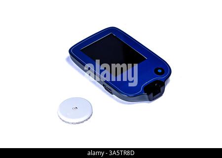 Insulin pump and sensor measuring glucose level for diabetes therapy Stock Photo