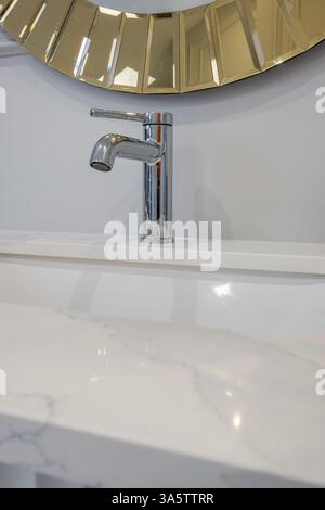 water tap sink with faucet and mirror in expensive bathroom Stock Photo
