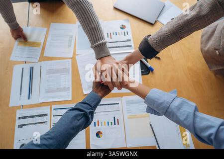 Top close up view of hands of the office workers, conception of teamwork. Stock Photo