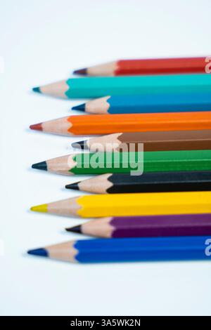 A dynamic photo of pencil Colors arranged in a creative pattern on a white background. Perfect for creative and educational campaigns. Stock Photo