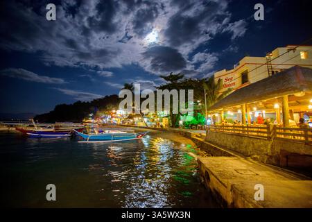Boats are moored in the main Sabang Bay of PUERTO GALERA, the PHILIPPINES Stock Photo