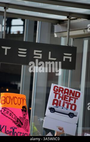 Tesla Takedown rally against Elon Musk and DOGE in front of a Tesla