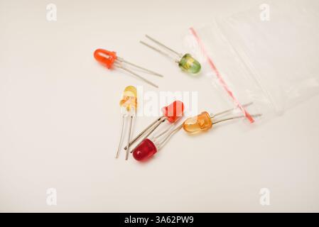 Multi-colored LEDs. Old LEDs on a white background. Stock Photo