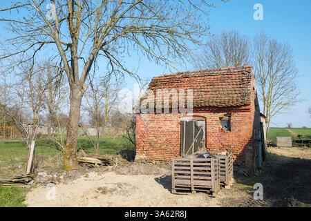 Old abandoned red brick building in the countryside. Stock Photo
