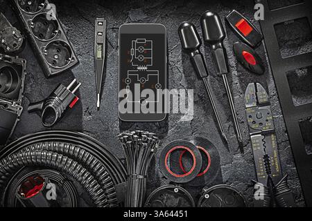 Electric Tools Set With Blueprint On Smartphone Display On Black Stone Background Stock Photo