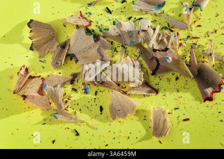 Color pencils and pencil peels over note paper Stock Photo