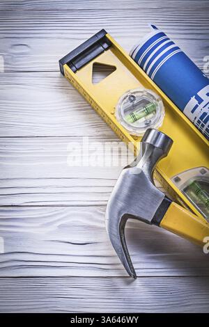 Blue rolled construction plans claw hammer on metallic background Stock ...