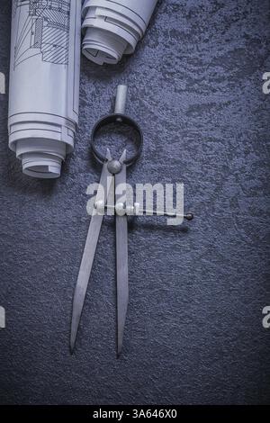 Blueprints drawing compass on black background construction concept Stock Photo