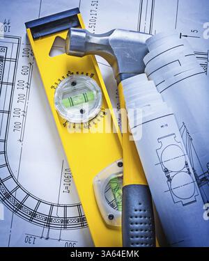 construction tools rolled blueprints level claw hammer helmet Stock ...