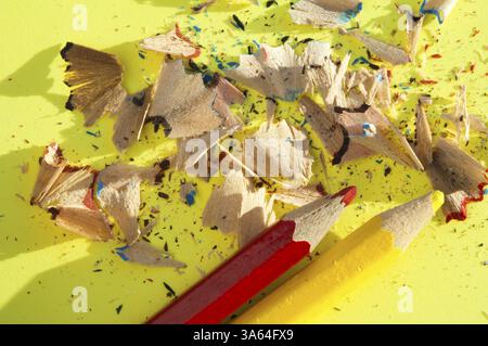 Color pencils and pencil peels over note paper Stock Photo