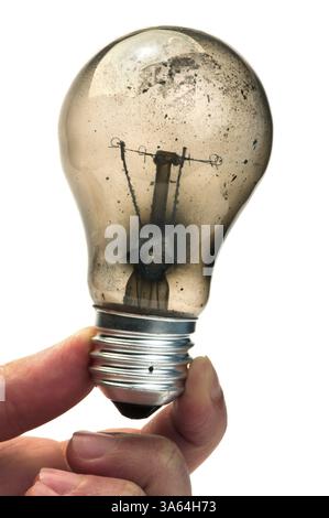 Old light bulb burned inside Stock Photo