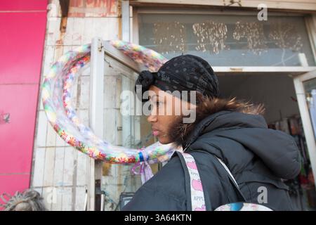 Tammy and friend buy gifts in the town to take home. A group of Nigerian and Egyptian students take a year out to study acrobatics at the China Wuqiao Stock Photo