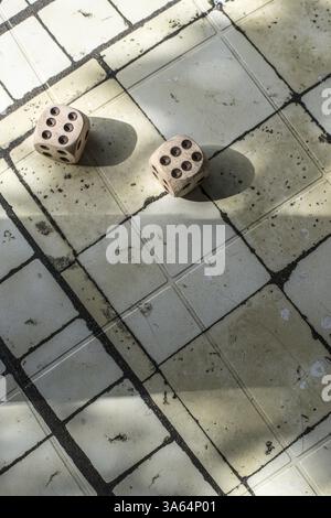Two wooden dices on table Stock Photo