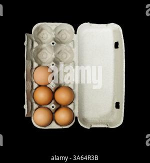 Eggs box and aggs inside. Isolated on black background Stock Photo