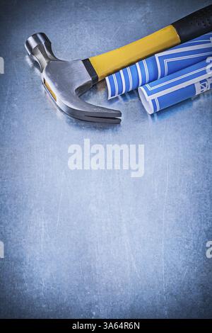 Blue construction drawings claw hammer on metallic background copyspace ...