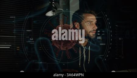 Man working on computer with digital virus graphic overlay, focused on screen Stock Photo