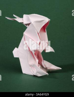 Paper made pink rabbit. 3D folded origami style Stock Photo