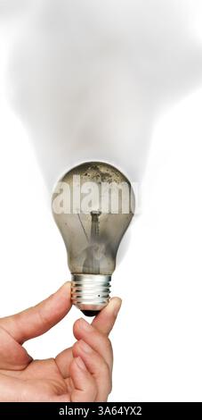 Old light bulb burned inside and smoke Stock Photo