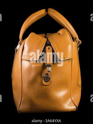 Old vintage luggage brown bag. Black isolated Stock Photo