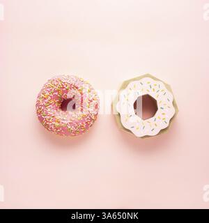 Creative concept still life health diet photo of real donut pastry dessert junk food and one made of paper on pink background Stock Photo