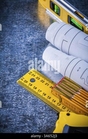 Construction level blueprints and instruments of measurement on metallic background building and architecture concept Stock Photo