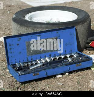 Car mechanic tools and sport tire Stock Photo
