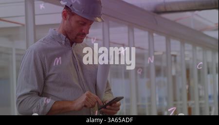 Digital composition of multiple alphabets floating against male architect using smartphone Stock Photo