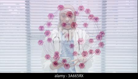 Image of network of connection with interface medical icons forming a globe over female doctor Stock Photo