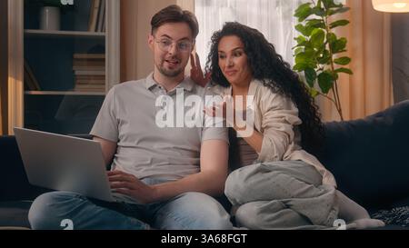 Multiracial couple multiethnic Caucasian man male guy husband boyfriend with Hispanic Latina woman female girl wife girlfriend emotional discuss Stock Photo