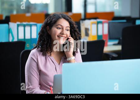 Corporate Woman Is Talking On Call Stock Photo