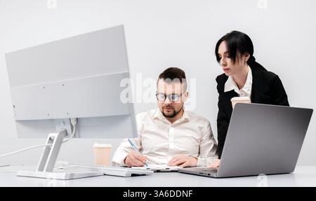 Specialists in the office discuss and solve the problem of declining sales and revenues. The concept is to show teamwork, analysis Stock Photo