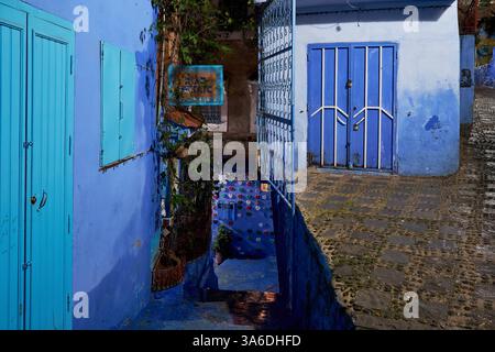 Beautiful illuminated empty street at night in the blue walled old town, Chefchaouen, Morocco Stock Photo