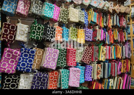 Closeup of beautiful colorful multicolor and multipattern ladies purses at souvenirs stall, Chefchaouen, Morocco Stock Photo