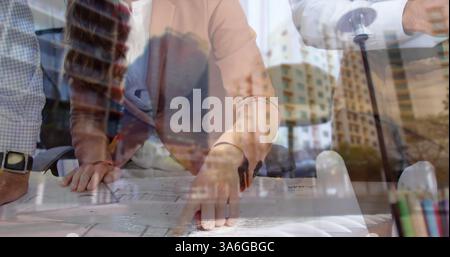 Architects collaborating on blueprints in modern office, planning urban development. Architecture, collaboration, teamwork, design, innovation, brains Stock Photo