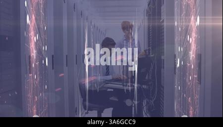Image of network of connections and glowing spot of light against two technicians working. digital online security computer concept Stock Photo