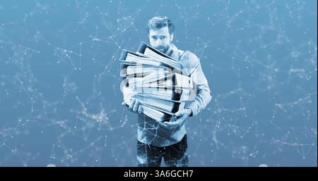 Carrying large stack of binders, businessman overwhelmed with paperwork and deadlines. Office, stress, multitasking, workload, pressure, corporate Stock Photo