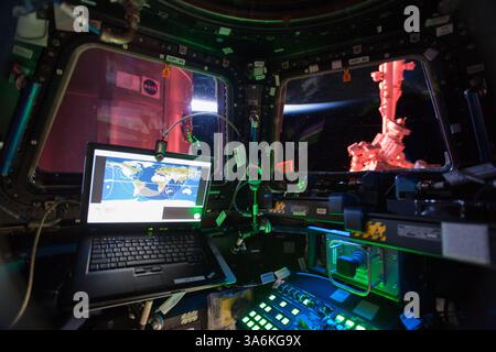 Jan 15, 2015 - Space - The interior cockpit view from the International Space Station's Cupola module taken on Jan. 4, 2015. The large bay windows allows the Expedition 42 crew to see outside. The Cupola houses one of the space station's two robotic work stations used by astronauts to manipulate the large robotic arm seen through the right window. The robotic arm, or Canadarm2, was used throughout the construction of the station and is still used to grapple visiting cargo vehicles and assist astronauts during spacewalks. The Cupola is attached to the nadir side of the space station and also gi Stock Photo